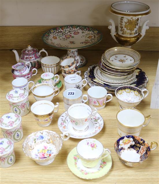 A collection of 19th century floral painted teaware and a French gilt decorated two handled vase